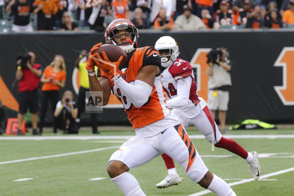 Gary Landers Cincinnati Bengals wide receiver Tyler Boyd (83) catches a pass before running in a touchdown in the second half of an NFL football game against the Cincinnati Bengals, Sunday, Oct. 6, 2019, in Cincinnati. (AP Photo/Gary Landers)
