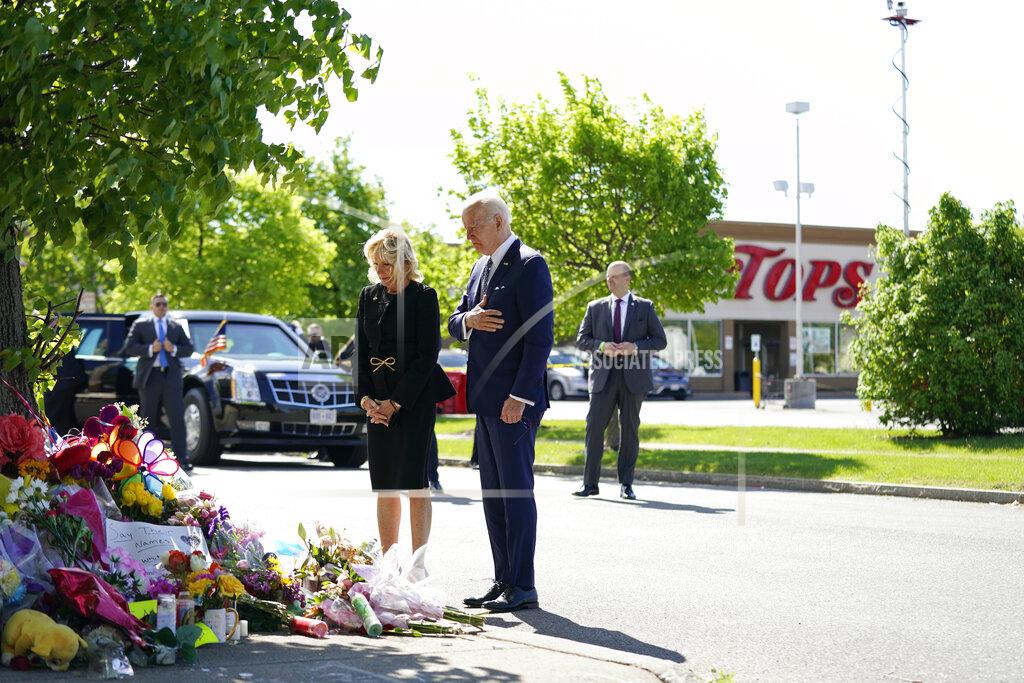 Andrew Harnik President Joe Biden and first lady Jill Biden visit the scene of a shooting at a supermarket to pay respects and speak to families of the victims of Saturday's shooting in Buffalo, N.Y., Tuesday, May 17, 2022. (AP Photo/Andrew Harnik)