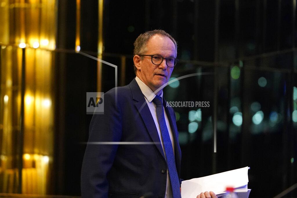 FILE - In this Tuesday, Feb. 9, 2021 file photo, Peter Ben Embarek of a World Health Organization team arrives for a joint press conference at the end of their mission to investigate the origins of the coronavirus pandemic in Wuhan in central China's Hubei province. Peter Ben Embarek, the head of a World Health Organization team, working with Chinese colleagues to finish a long-awaited report into the origins of the coronavirus, said in interviews on Wednesday and Thursday that the team hopes the report will be ready for release next week. (AP Photo/Ng Han Guan, file)