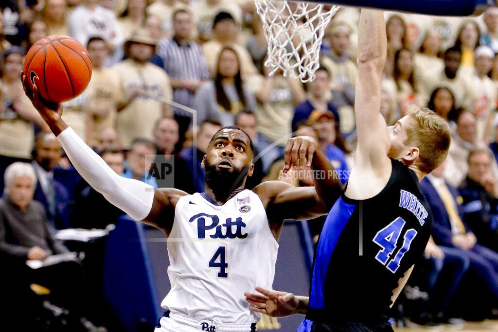 Keith Srakocic Pittsburgh's Jared Wilson-Frame (4) shoots as Duke's Jack White (41) defends during the first half of an NCAA college basketball game, Tuesday, Jan. 22, 2019, in Pittsburgh. (AP Photo/Keith Srakocic)