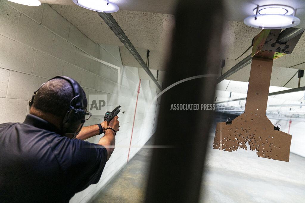 David Goldman Chad King, who started the Detroit chapter of the National African American Gun Association and teaches de-escalation training, practices at a shooting range in Taylor, Mich., Wed, Oct. 28, 2020. King started his group in 2017 to promote responsible gun ownership in the Black community. Now the nation is on edge contemplating the added threat of possible clashes in the wake of Election Day. Some of his students sought gun ownership as far right groups appear to them to have become more emboldened. Weeks ago, a group of white men were arrested for allegedly plotting to kidnap the Democratic governor of Michigan. Trump has refused to promise a peaceful transfer of power. He told a far-right group to “stand back and stand by.” (AP Photo/David Goldman)