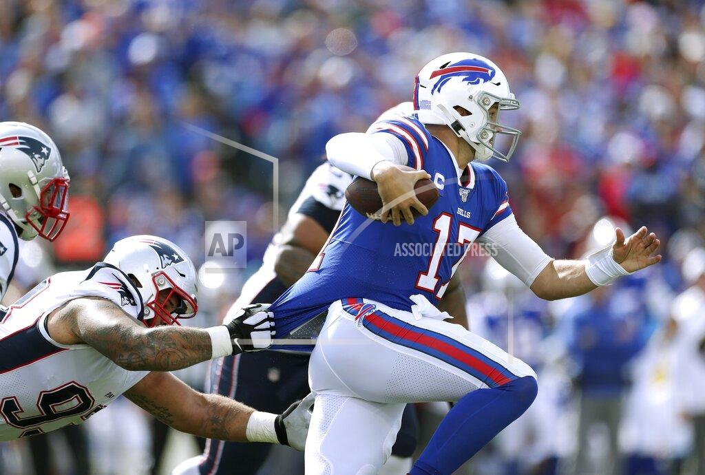 Ron Schwane Buffalo Bills quarterback Josh Allen tries to break free from the grasp of of New England Patriots defensive tackle Lawrence Guy in the first half of an NFL football game, Sunday, Sept. 29, 2019, in Orchard Park, N.Y. (AP Photo/Ron Schwane)