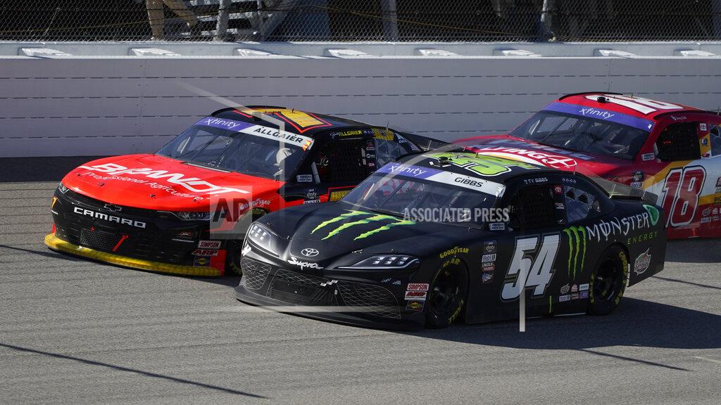 Paul Sancya Ty Gibbs (54) and Justin Allgaier (7) race during the New Holland 250 NASCAR Xfinity Series auto race at the Michigan International Speedway in Brooklyn, Mich., Saturday, Aug. 6, 2022. (AP Photo/Paul Sancya)