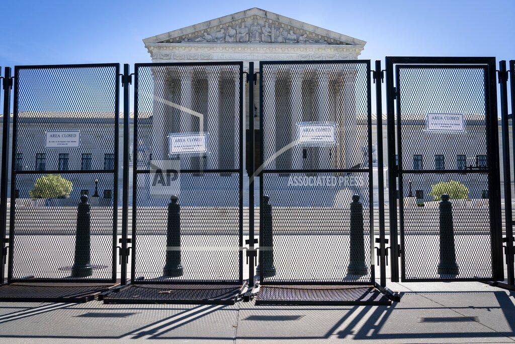 Jacquelyn Martin FILE - Anti-scaling fencing blocks off the Supreme Court, May 10, 2022, in Washington. (AP Photo/Jacquelyn Martin, File)