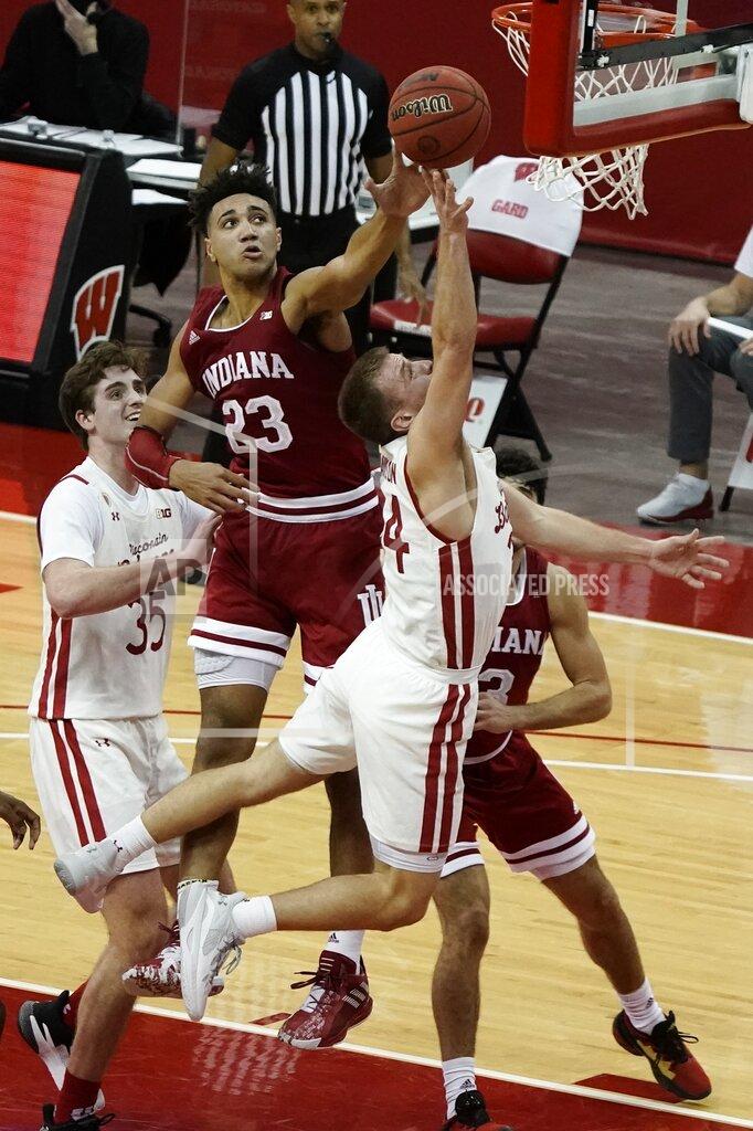 Morry Gash Indiana's Trayce Jackson-Davis block the shot of Wisconsin's Brad Davison during overtime of an NCAA college basketball game Thursday, Jan. 7, 2021, in Madison, Wis. (AP Photo/Morry Gash)