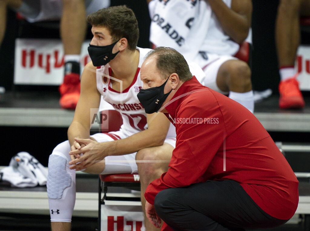 Andy Manis Wisconsin coach Greg Gard and guard Trevor Anderson watch from the bench during the second half of the team's NCAA college basketball game against Eastern Illinois Wednesday, Nov. 25, 2020, in Madison, Wis. Wisconsin won 77-67. (AP Photo/Andy Manis)
