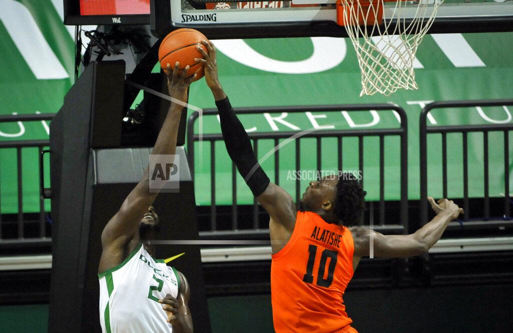 Andy Nelson Oregon State forward Warith Alatishe (10) blocks the shot of Oregon forward Eugene Omoruyi (2) during the first half of an NCAA college basketball game Saturday, Jan. 23, 2021, in Eugene, Ore. (AP Photo/Andy Nelson)