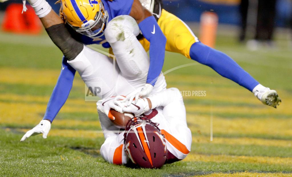 Keith Srakocic Virginia Tech wide receiver Eric Kumah (83) makes a catch for a touchdown as Pittsburgh defensive back Jason Pinnock (15) defends in the third quarter of an NCAA football game, Saturday, Nov. 10, 2018, in Pittsburgh. Pittsburgh won 52-22.(AP Photo/Keith Srakocic)