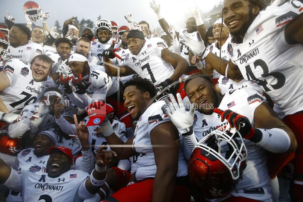 Patrick Semansky Cincinnati players celebrate after winning the Military Bowl NCAA college football game against Virginia Tech, Monday, Dec. 31, 2018, in Annapolis, Md. Cincinnati won 35-31. (AP Photo/Patrick Semansky)