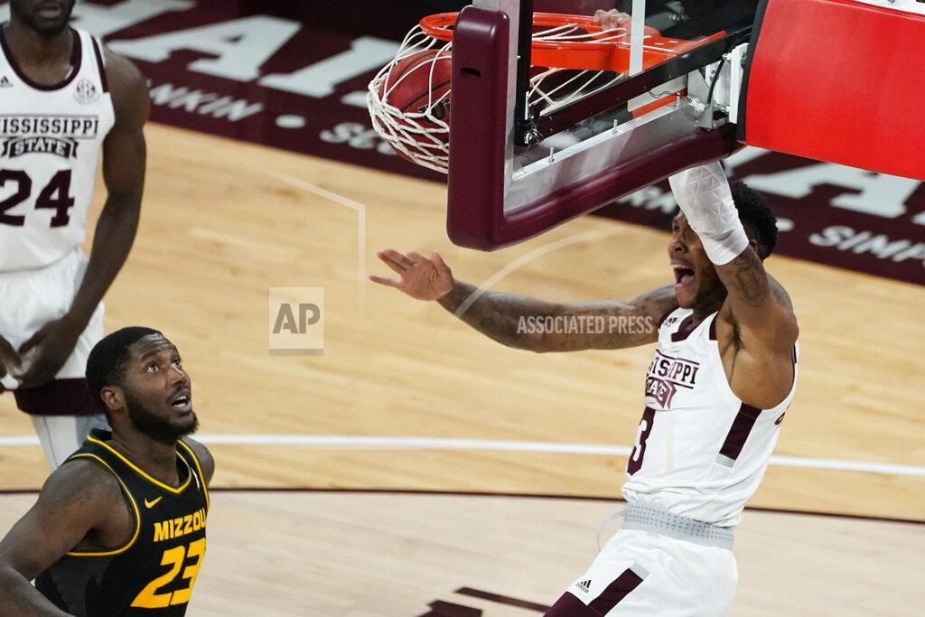 Rogelio V. Solis Mississippi State guard D.J. Stewart Jr. (3) shouts as he dunks next to Missouri forward Jeremiah Tilmon (23) during the first half of an NCAA college basketball game Tuesday, Jan. 5, 2021, in Starkville, Miss. (AP Photo/Rogelio V. Solis)