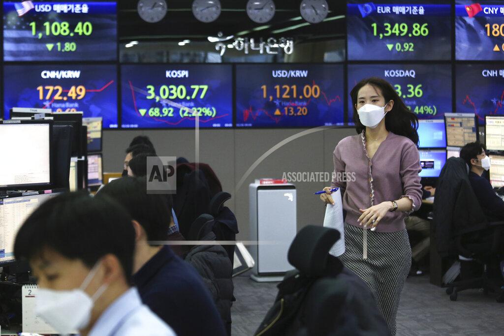 Ahn Young-Joon A currency trader runs at the foreign exchange dealing room of the KEB Hana Bank headquarters in Seoul, South Korea, Friday, Feb. 26, 2021. Asian shares skidded Friday after rising bond yields triggered a broad sell-off on Wall Street that erased the markets gain for the week and handed the Nasdaq composite index its steepest loss since October. (AP Photo/Ahn Young-joon)