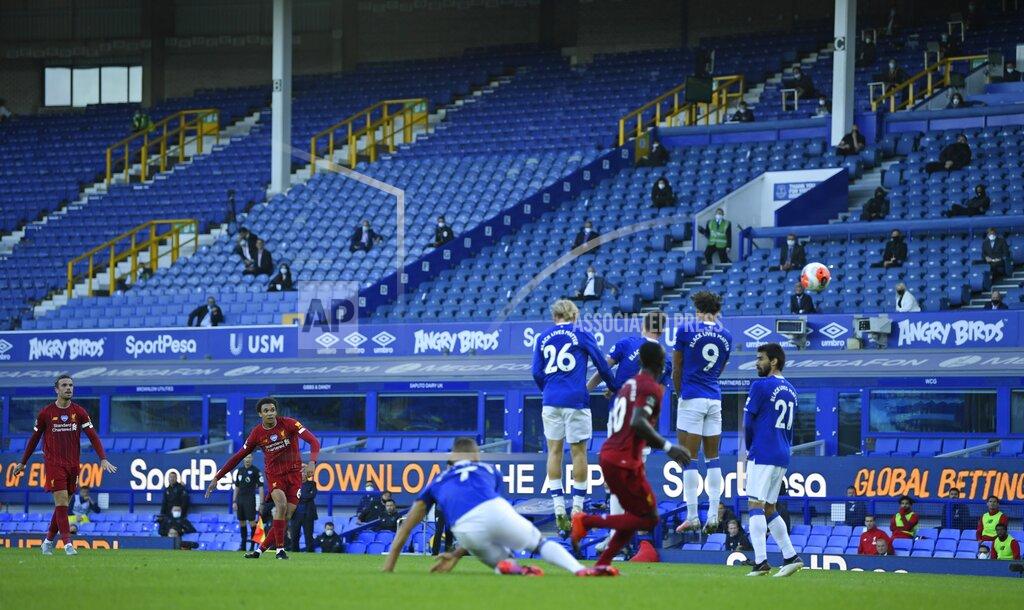 Shaun Botterill Liverpool's Trent Alexander-Arnold takes a free-kick during the English Premier League soccer match between Everton and Liverpool at Goodison Park in Liverpool, England, Sunday, June 21, 2020. (AP photo/Shaun Botterill, Pool)