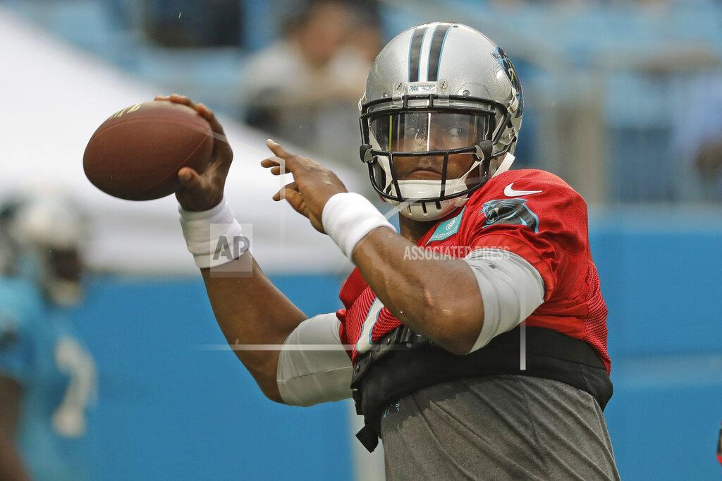 Chuck Burton Carolina Panthers quarterback Cam Newton looks to pass during a Fan Fest practice at the NFL football team's training camp in Charlotte, N.C., Friday, Aug. 2, 2019. (AP Photo/Chuck Burton)