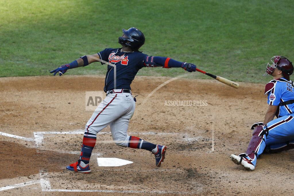 Matt Slocum Atlanta Braves' Ronald Acuna Jr. follows through after hitting a home run off Philadelphia Phillies pitcher Spencer Howard during the fifth inning of the second baseball game in a doubleheader, Sunday, Aug. 9, 2020, in Philadelphia. (AP Photo/Matt Slocum)