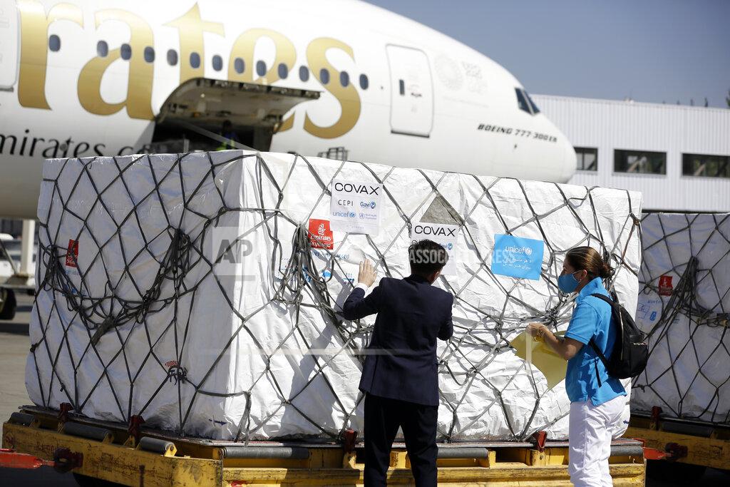 Mariam Zuhaib FILE - In this Friday, July 9, 2021 file photo, UNICEF workers check the first shipment of 1.4 million Johnson & Johnson COVID-19 vaccine doses donated by the United States, at the Hamid Karzai International Airport, in Kabul, Afghanistan. In late June, the international system for sharing coronavirus vaccines sent about 530,000 doses to Britain – more than double the amount sent that month to the entire continent of Africa. It was the latest example of how a system that was supposed to guarantee low and middle-income countries vaccines is failing, leaving them at the mercy of haphazard donations from rich countries.(AP Photo/Mariam Zuhaib, file )