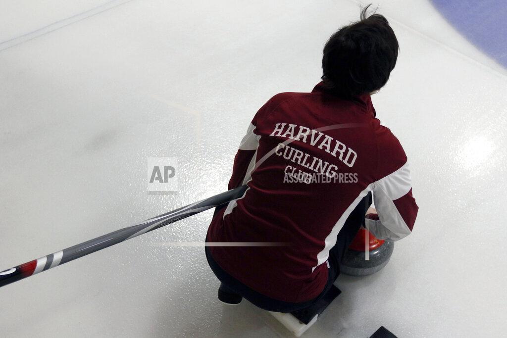 Bill Sikes Harvard's Julia Ebert pauses before delivering a rock during the college curling national championship, Friday, March 8, 2019, in Wayland, Mass. (AP Photo/Bill Sikes)