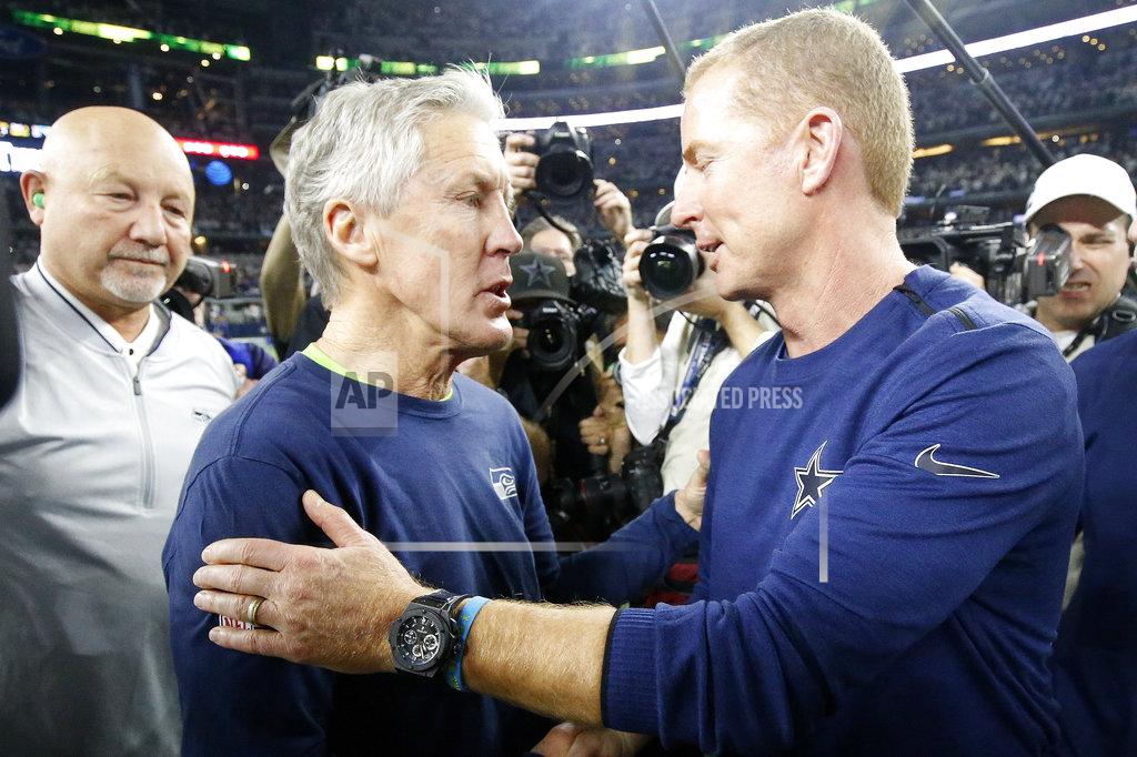 Michael Ainsworth Seattle Seahawks head coach Pete Carroll, left, speaks with Dallas Cowboys head coach Jason Garrett after the NFC wild-card NFL football game in Arlington, Texas, Saturday, Jan. 5, 2019. The Cowboys won 24-22. (AP Photo/Michael Ainsworth)