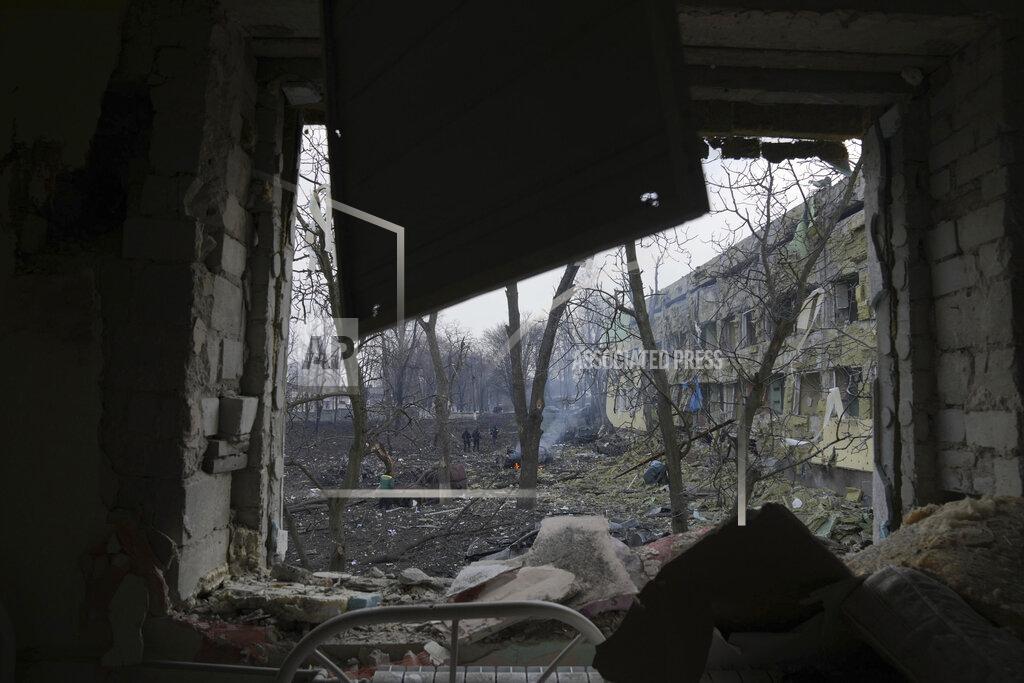 Evgeniy Maloletka FILE - A view onto the yard of a maternity hospital damaged in a shelling attack in Mariupol, Ukraine, Wednesday, March 9, 2022. Associated Press journalists, who have been reporting from inside blockaded Mariupol since early in the war, documented this attack on the hospital and saw the victims and damage firsthand. They shot video and photos of several bloodstained, pregnant mothers fleeing the blown-out maternity ward, medics shouting, children crying. (AP Photo/Evgeniy Maloletka, File)