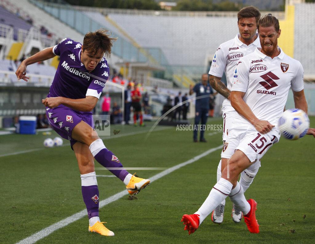 Marco Bucco Torino's Cristian Ansaldi, right, vies for the ball with Fiorentina's Federico Chiesa during the Italian Serie A soccer match between Fiorentina and Torino, at the Artemio Franchi stadium, in Florence, Italy, Saturday, Sept. 19, 2020 (Marco Bucco/LaPresse via AP)