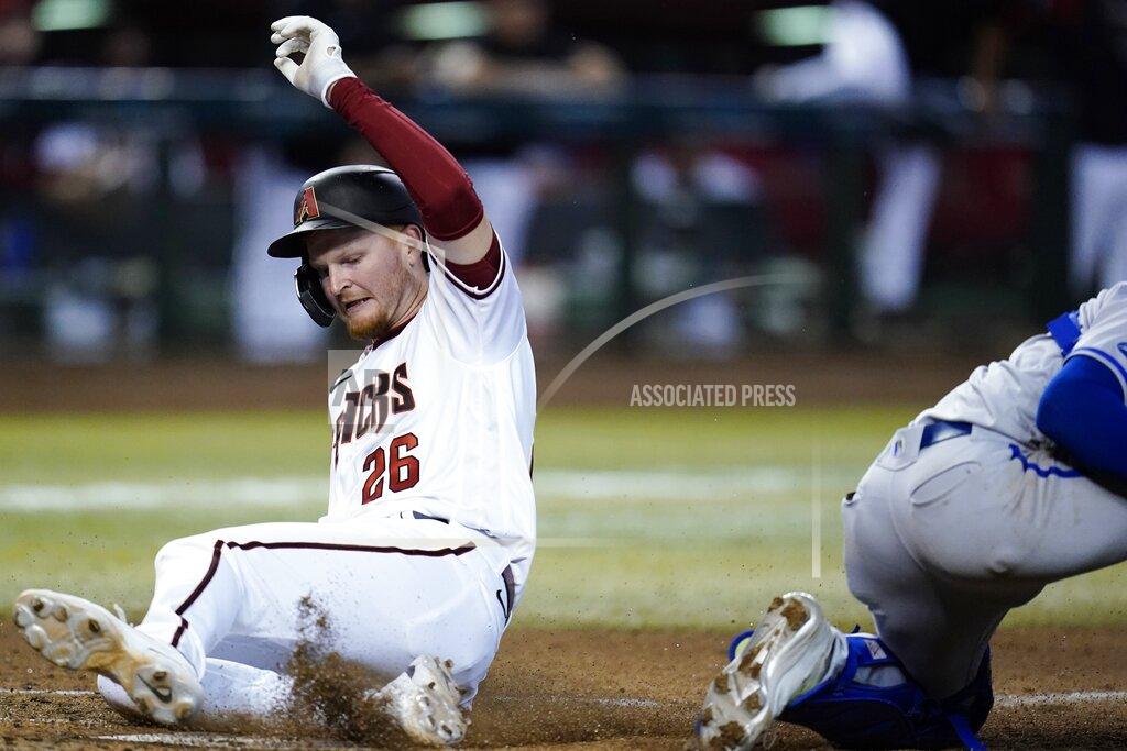 Ross D. Franklin Arizona Diamondbacks' Pavin Smith scores a run against the Kansas City Royals during the fourth inning of a baseball game Monday, May 23, 2022, in Phoenix. (AP Photo/Ross D. Franklin)