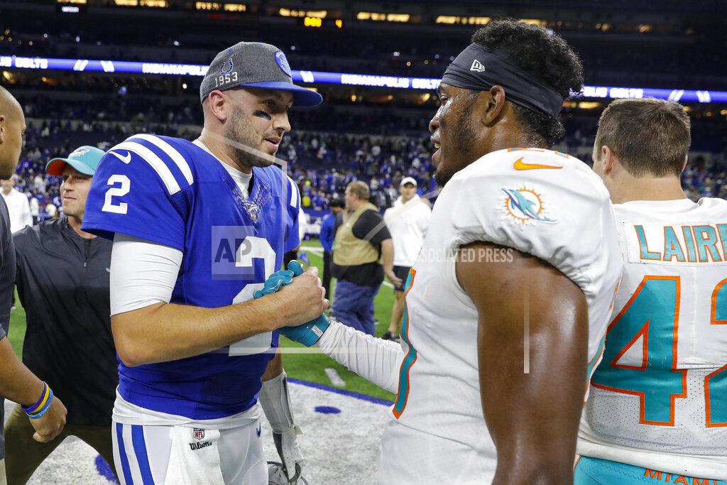 Darron Cummings Indianapolis Colts quarterback Brian Hoyer (2) clasps hands with Miami Dolphins cornerback Eric Rowe following an NFL football game in Indianapolis, Sunday, Nov. 10, 2019. The Dolphins won 16-12. (AP Photo/Darron Cummings)