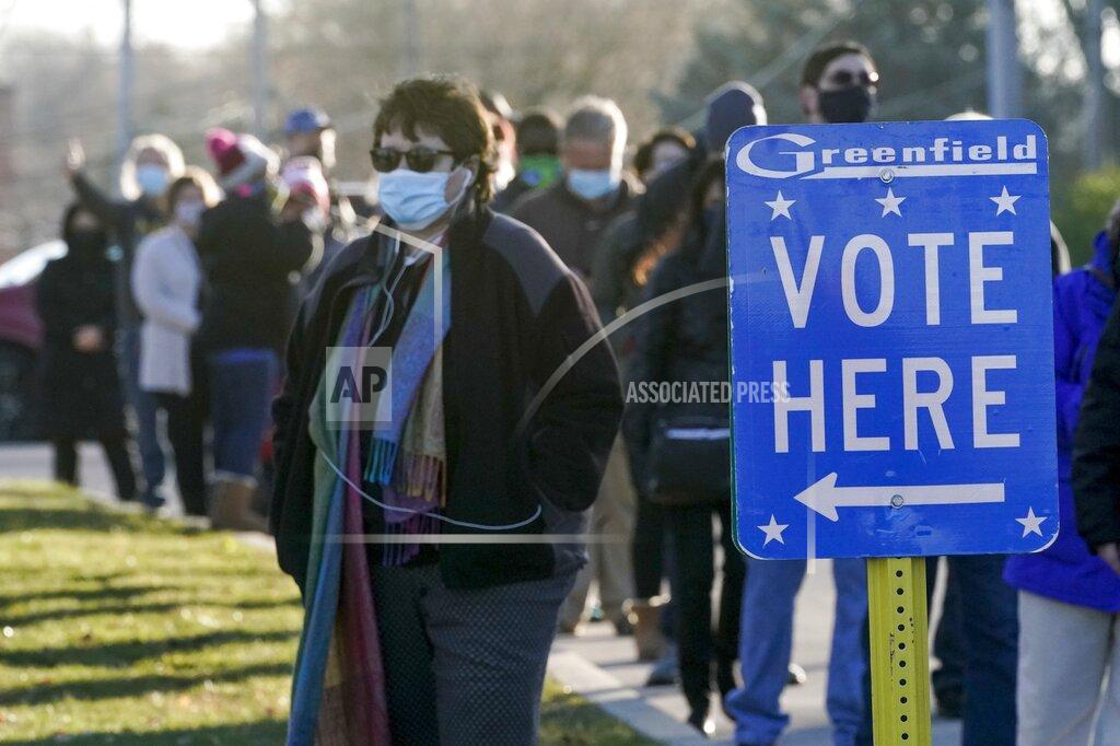 Morry Gash People line up to vote outside the Greenfield Community Center Tuesday, Nov. 3, 2020, in Greenfield, Wis. (AP Photo/Morry Gash)
