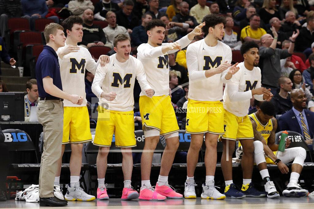 Nam Y. Huh Michigan bench react during the first half of an NCAA college basketball game against Iowa in the quarterfinals of the Big Ten Conference tournament, Friday, March 15, 2019, in Chicago. (AP Photo/Nam Y. Huh)