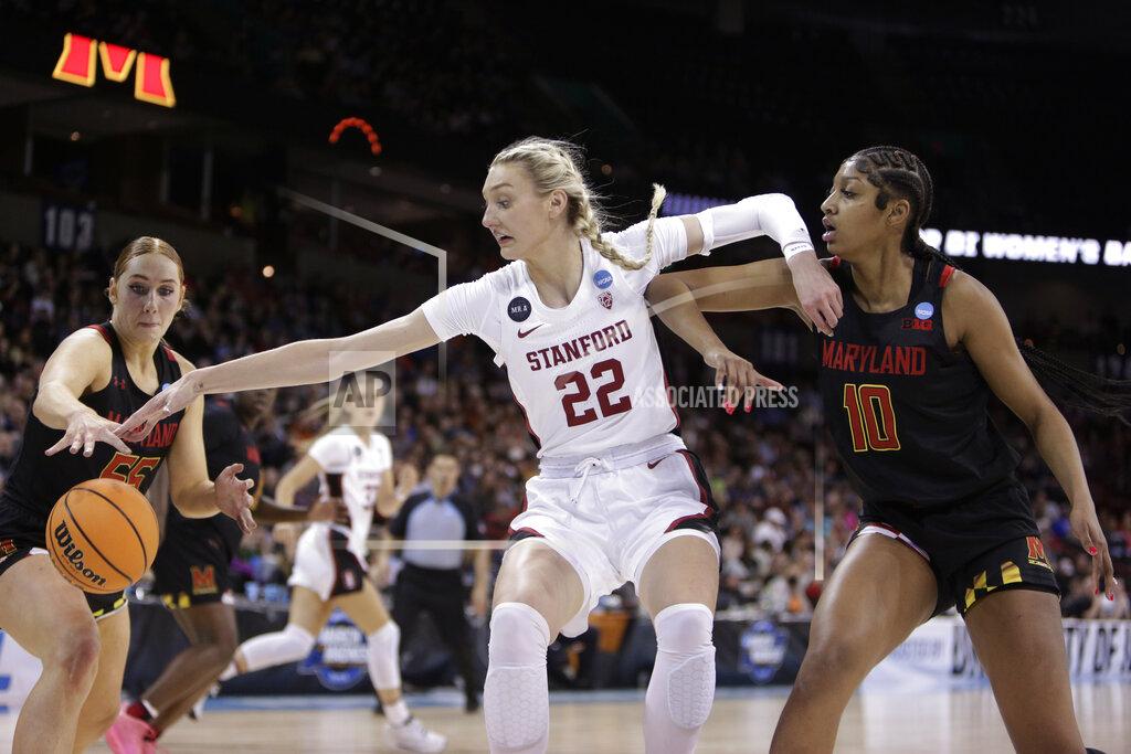 Young Kwak Stanford forward Cameron Brink (22) holds off Maryland forward Angel Reese (10) as she reaches for the ball with Maryland forward Chloe Bibby, left, during the first half of a college basketball game in the Sweet 16 round of the NCAA tournament, Friday, March 25, 2022, in Spokane, Wash. (AP Photo/Young Kwak)