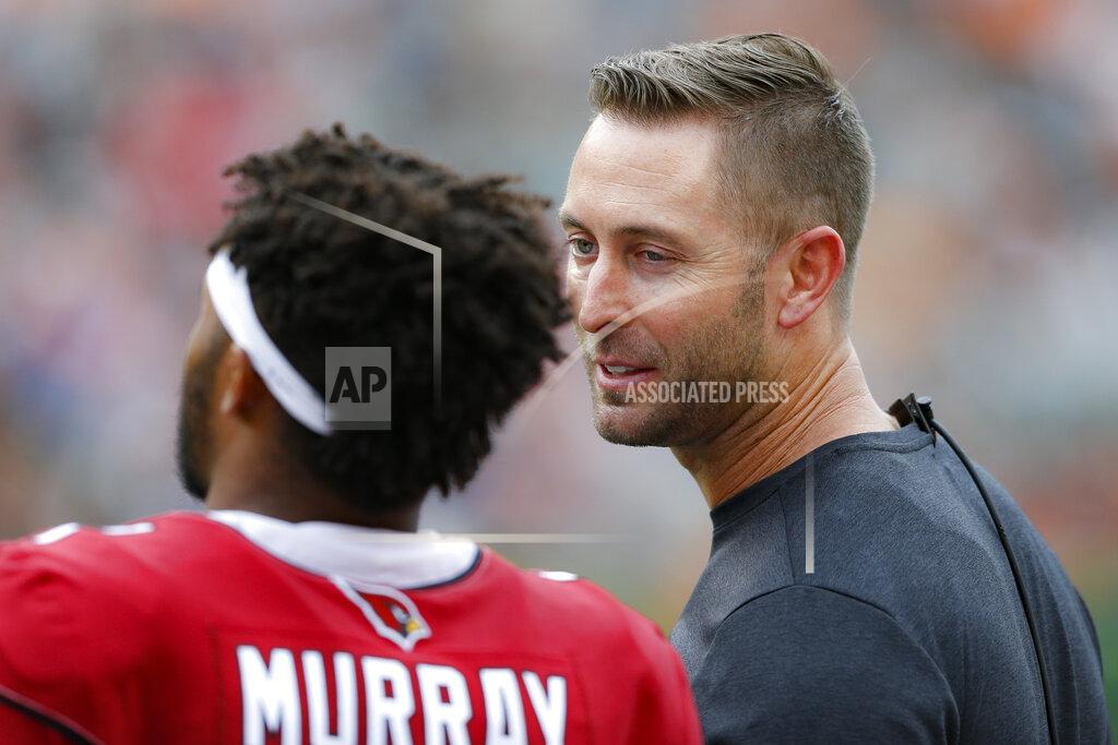 Gary Landers Arizona Cardinals head coach Kliff Kingsbury, right, speaks with quarterback Kyler Murray, left, in the first half of an NFL football game against the Cincinnati Bengals, Sunday, Oct. 6, 2019, in Cincinnati. (AP Photo/Gary Landers)