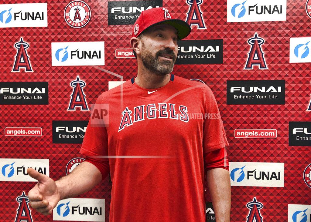 Los Angeles Angels pitching coach Mickey Callaway speaks about his philosophies outside the clubhouse at Tempe Diablo Stadium in Tempe, Ariz., on Friday, Feb. 14, 2020. After his difficult two-year tenure as the New York Mets' manager ended last fall, Callaway says he is energized by his return to a familiar role as he becomes a key assistant to new Angels manager Joe Maddon. (AP Photo/Greg Beacham)