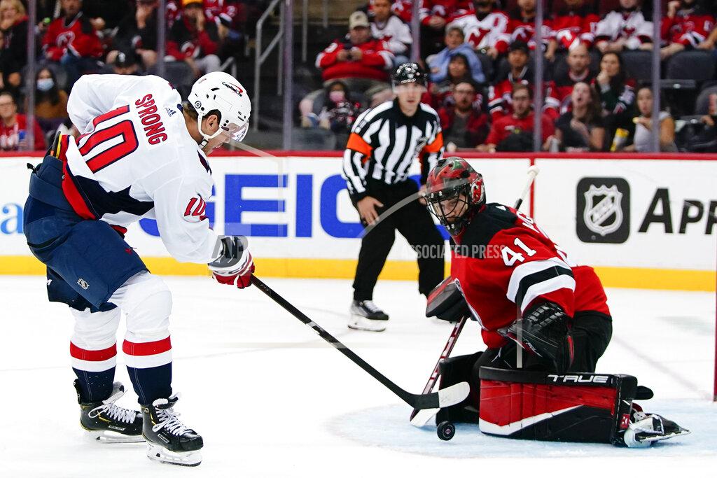 Frank Franklin Ii Washington Capitals' Daniel Sprong (10) shoots the puck past New Jersey Devils goaltender Scott Wedgewood (41) for a goal during the second period of an NHL hockey game Thursday, Oct. 21, 2021, in Newark, N.J. (AP Photo/Frank Franklin II)