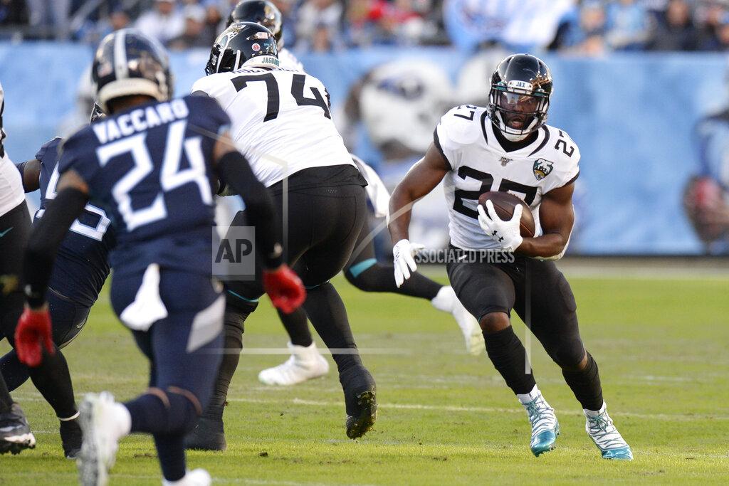 Mark Zaleski Jacksonville Jaguars running back Leonard Fournette (27) carries the ball against the Tennessee Titans in the first half of an NFL football game Sunday, Nov. 24, 2019, in Nashville, Tenn. (AP Photo/Mark Zaleski)