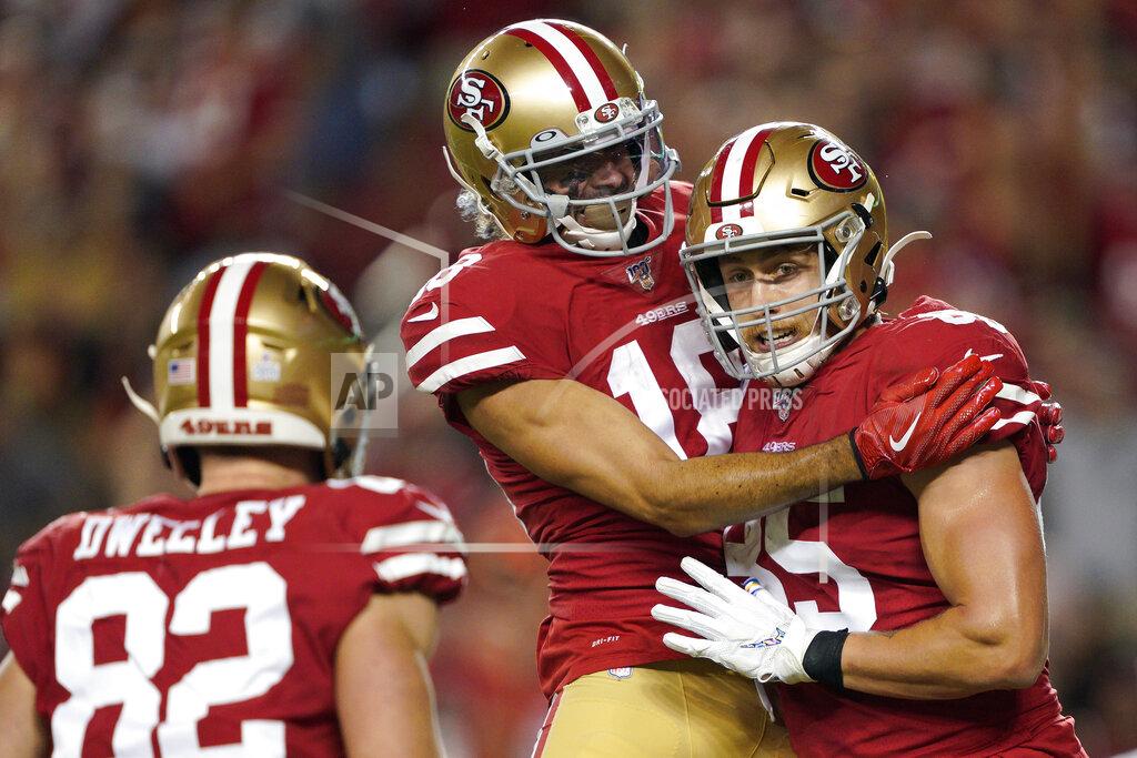 Tony Avelar San Francisco 49ers tight end George Kittle, right, celebrates with Dante Pettis, center, and Ross Dwelley after scoring against the Cleveland Browns during the second half of an NFL football game in Santa Clara, Calif., Monday, Oct. 7, 2019. (AP Photo/Tony Avelar)