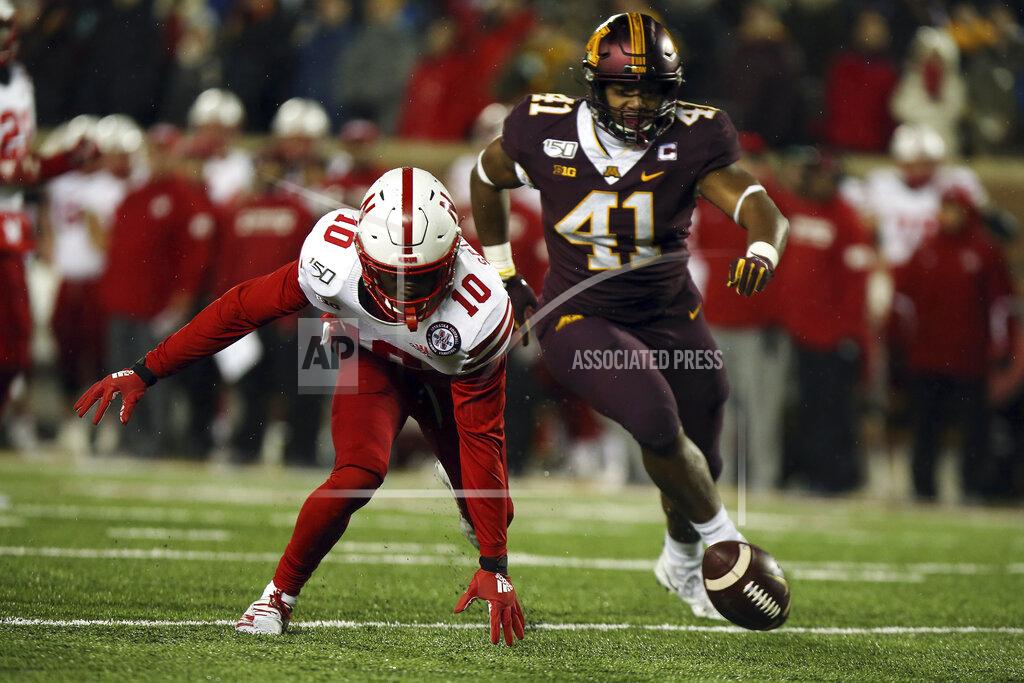 Stacy Bengs Nebraska wide receiver JD Spielman tries to grab the ball he fumbled against Minnesota linebacker Thomas Barber during the second half of an NCAA college football game Saturday, Oct. 12, 2019, in Minneapolis. (AP Photo/Stacy Bengs)