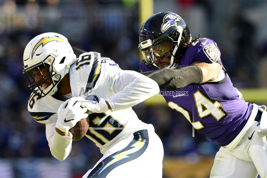 Gail Burton Los Angeles Chargers wide receiver Tyrell Williams, left, rushes past Baltimore Ravens cornerback Brandon Carr in the first half of an NFL wild card playoff football game, Sunday, Jan. 6, 2019, in Baltimore. (AP Photo/Gail Burton)