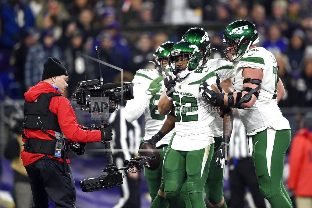 Gail Burton New York Jets wide receiver Jamison Crowder (82) is congratulated by teammates after catching a touchdown pass from quarterback Sam Darnold, not visible, during the first half of an NFL football game against the Baltimore Ravens, Thursday, Dec. 12, 2019, in Baltimore. (AP Photo/Gail Burton)