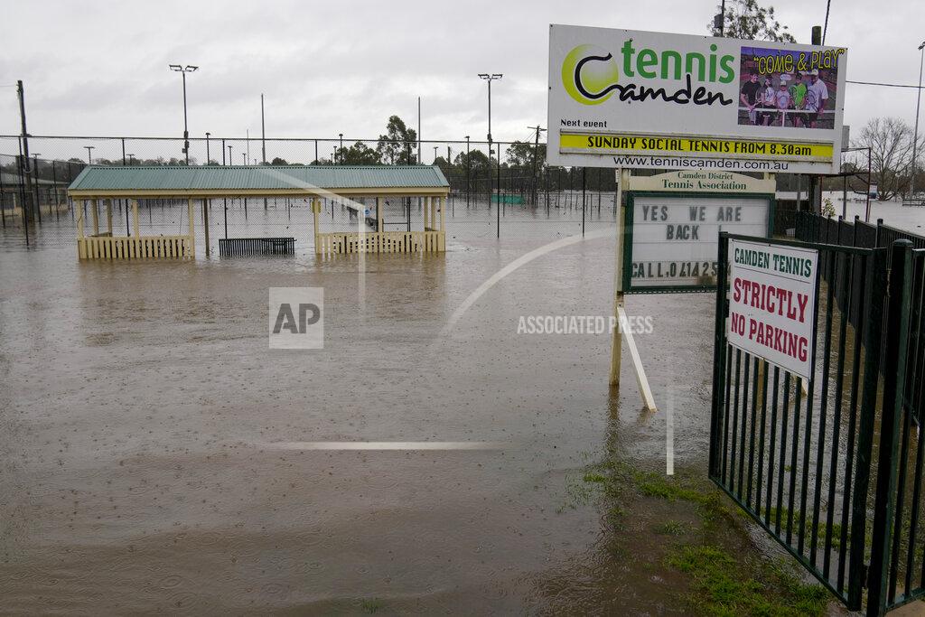 Mark Baker This photos shows a flooded sports venue in Camden on the outskirts of Sydney, Australia, Monday, July 4, 2022. More than 30,000 residents of Sydney and its surrounds have been told to evacuate or prepare to abandon their homes on Monday as Australia’s largest city braces for what could be its worst flooding in 18 months. (AP Photo/Mark Baker)