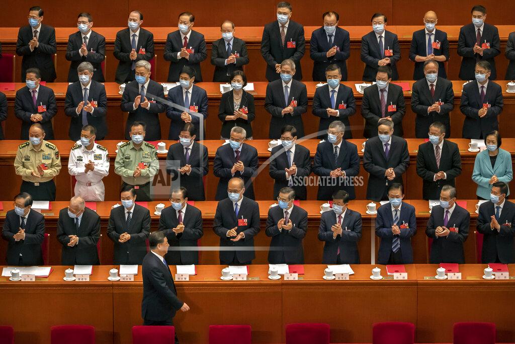 Mark Schiefelbein FILE - In this May 28, 2020, file photo, delegates applaud as Chinese President Xi Jinping arrives for the closing session of China's National People's Congress (NPC) in Beijing. The annual gathering of the National People's Congress and its advisory body, the Chinese People's Political Consultative Conference, brings handpicked delegates from across the country to discuss governing priorities and receive instructions from the ruling Communist Party leadership. (AP Photo/Mark Schiefelbein, File)