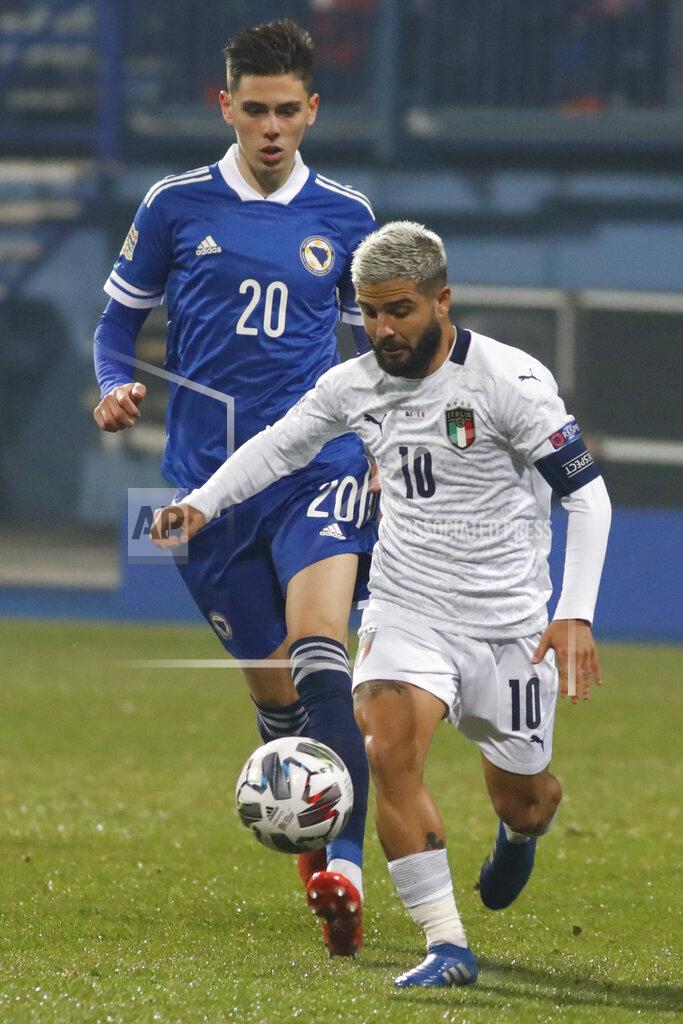 Kemal Softic Italy's Lorenzo Insigne, right, is challenged by Bosnia's Dennis Hadzikadunic during the UEFA Nations League soccer match between Bosnia and Italy, in Sarajevo, Bosnia, Wednesday, Nov. 18, 2020. (AP Photo/Kemal Softic)
