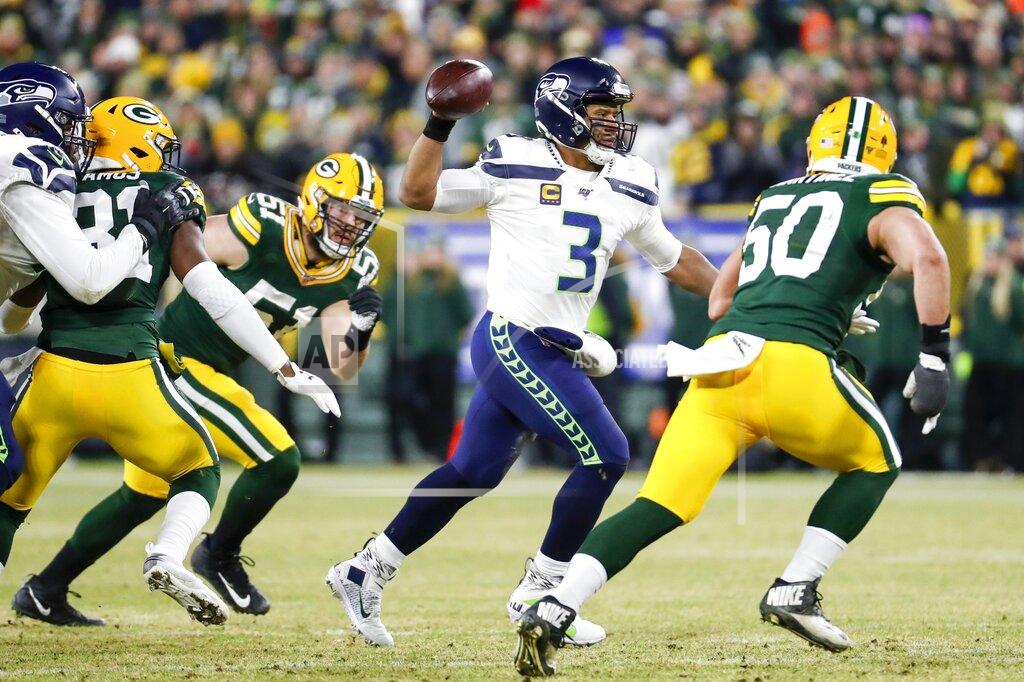 Matt Ludtke Seattle Seahawks quarterback Russell Wilson throws during the first half of an NFL divisional playoff football game against the Green Bay Packers Sunday, Jan. 12, 2020, in Green Bay, Wis. (AP Photo/Matt Ludtke)