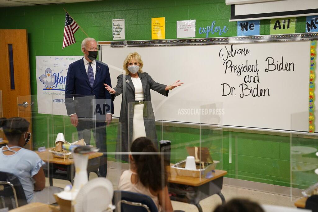 Evan Vucci President Joe Biden and first lady Jill Biden talk to students during a visit to Yorktown Elementary School, Monday, May 3, 2021, in Yorktown, Va. (AP Photo/Evan Vucci)