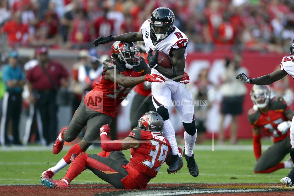 Jason Behnken Tampa Bay Buccaneers defensive back Jamel Dean (35) and strong safety Andrew Adams (39) team up to stop Atlanta Falcons wide receiver Julio Jones (11) after a catch during the first half of an NFL football game Sunday, Dec. 29, 2019, in Tampa, Fla. (AP Photo/Jason Behnken)
