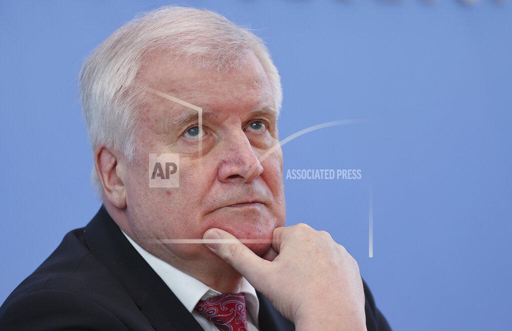 Fabrizio Bensch German Interior Minister Horst Seehofer, attends a news conference on politically motivated crimes in Berlin, Germany, Wednesday, May 27, 2020. (Fabrizio Bensch/Pool via AP)