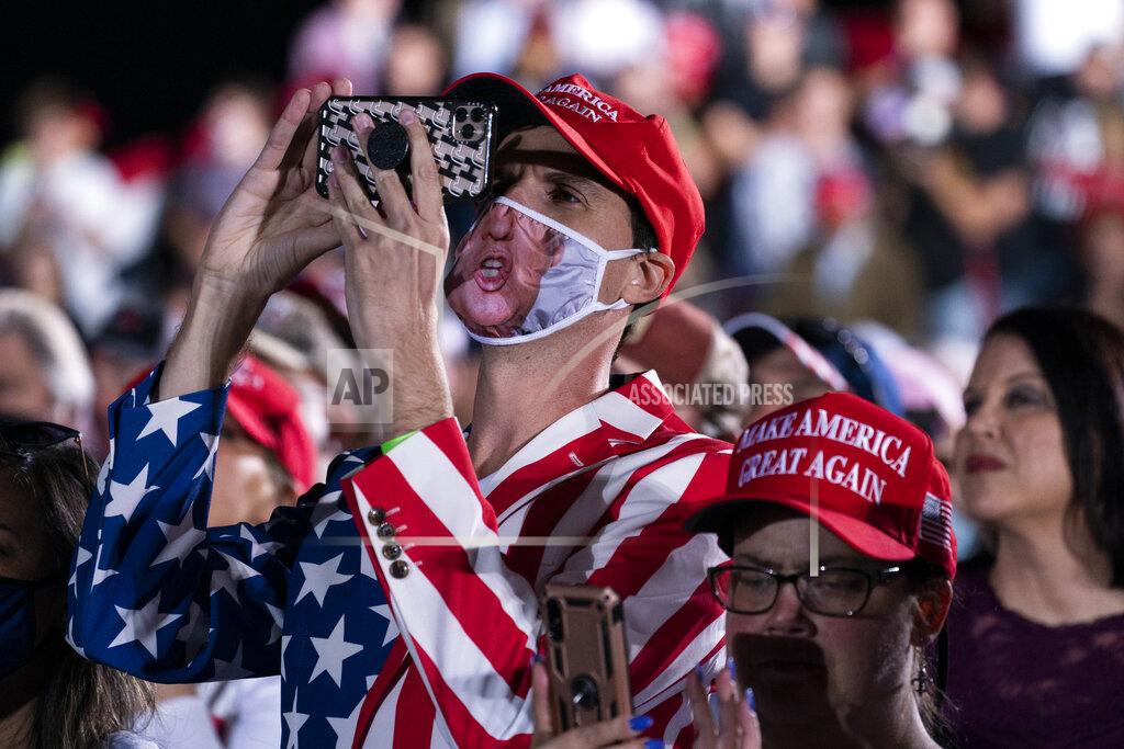 Evan Vucci Supporters of President Donald Trump listen to him speak to a campaign rally at Middle Georgia Regional Airport, Friday, Oct. 16, 2020, in Macon, Ga. (AP Photo/Evan Vucci)