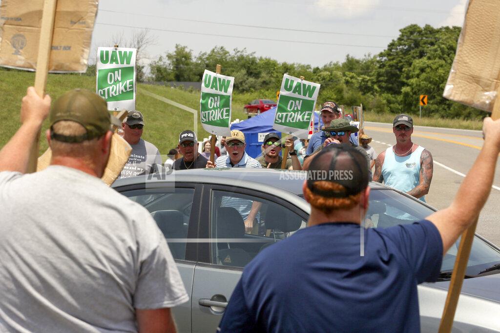 Matt Gentry FILE - In this June 18, 2021 file photo, striking UAW members express themselves at vehicles departing the Volvo Trucks North America plant in Dublin, Va. With Help Wanted signs at factories and businesses spreading across the nation, in manufacturing and in service industries, union workers like those at the Volvo site are seizing the opportunity to try to recover some of the bargaining power — and financial security — they feel they lost in recent decades as unions shrank in size and influence. (Matt Gentry/The Roanoke Times via AP)
