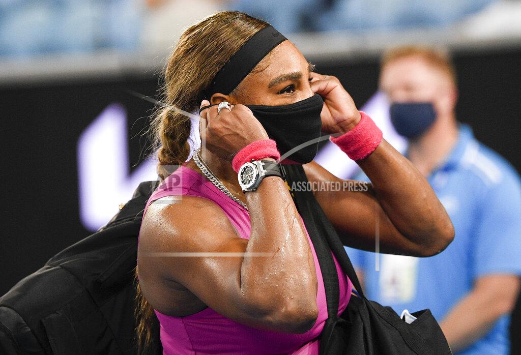 Andy Brownbill United States' Serena Williams adjusts her mask as she leaves the court following her match against compatriot Danielle Collins at a tuneup event ahead of the Australian Open tennis championships in Melbourne, Australia, Friday, Feb. 5, 2021.(AP Photo/Andy Brownbill)