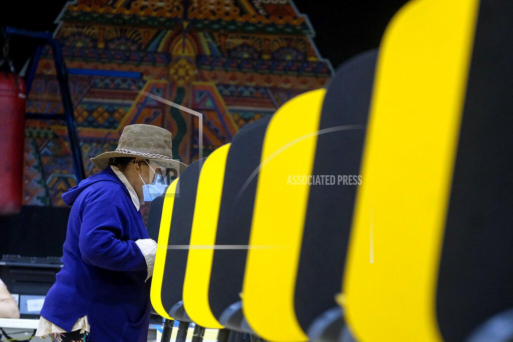 Ringo H.W. Chiu Ana Claribel Salazar, 69, casts a ballot at a vote center set up at the Lincoln Park Senior Center in Los Angeles, Tuesday, Sept. 14, 2021. The recall election that could remove California Democratic Gov. Gavin Newsom is coming to an end. Voting concludes Tuesday in the rare, late-summer election that has emerged as a national battlefront on issues from COVID-19 restrictions to climate change. (AP Photo/Ringo H.W. Chiu)