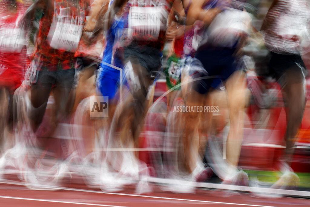 Petr David Josek Runners compete in a heat of the men's 5,000-meters at the 2020 Summer Olympics, Tuesday, Aug. 3, 2021, in Tokyo. (AP Photo/Petr David Josek)