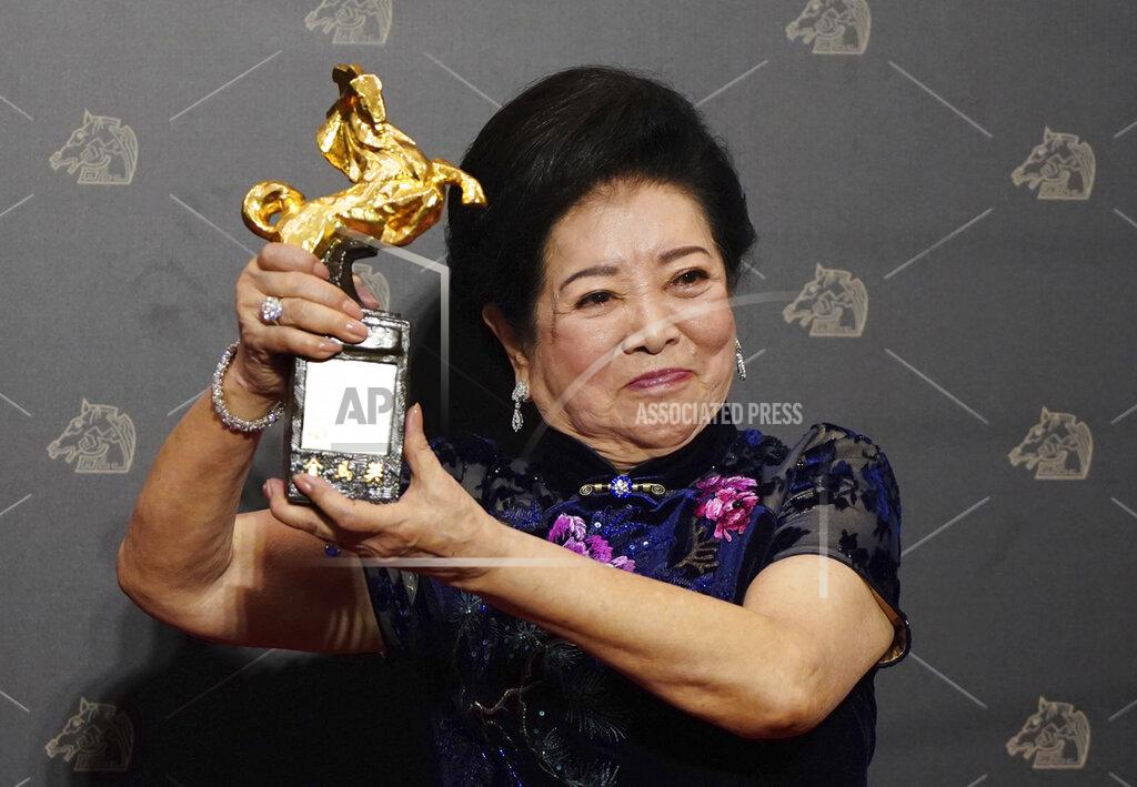 Billy Dai Taiwanese actress Chen Shu-fang holds her award for Best Supporting Actress at the 57th Golden Horse Awards in Taipei, Taiwan, Saturday, Nov. 21, 2020. Chen won for the film "Dear Tenant" at this year's Golden Horse Awards -the Chinese-language film industry'sbiggest annual events. (AP Photo/Billy Dai)