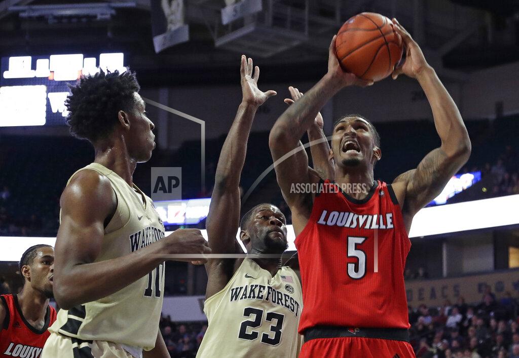 Chuck Burton Louisville's Malik Williams (5) drives to the basket against Wake Forest's Chaundee Brown (23) and Jaylen Hoard (10) during the first half of an NCAA college basketball game in Winston-Salem, N.C., Wednesday, Jan. 30, 2019. (AP Photo/Chuck Burton)